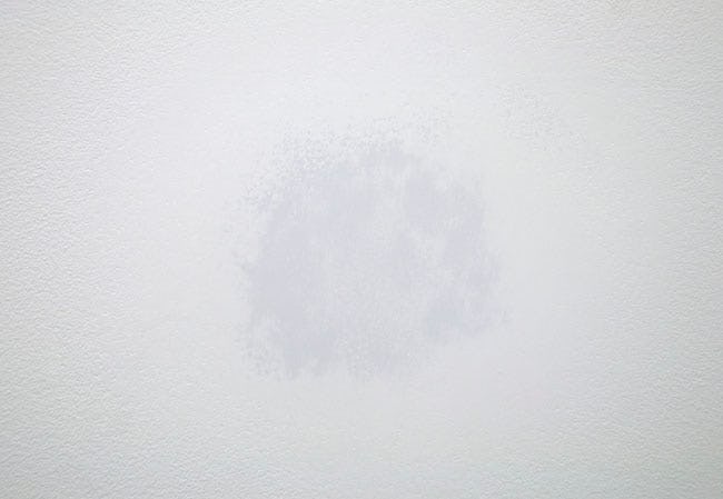 Untitled (2012). Wall rubbing, grey paint